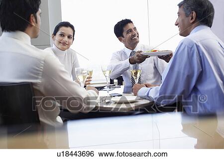 Business man taking meal from waiter during business meeting View Large Photo Image Stock Photograph - Business man taking meal from waiter during business meeting. Fotosearch