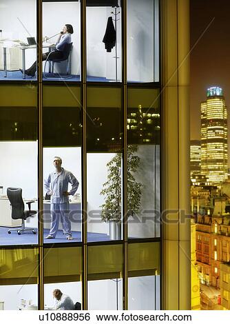 Business people and surgeon in offices, view from building exterior View Large Photo Image Stock Photograph - Business people and surgeon in offices, view from building exterior. Fotosearch