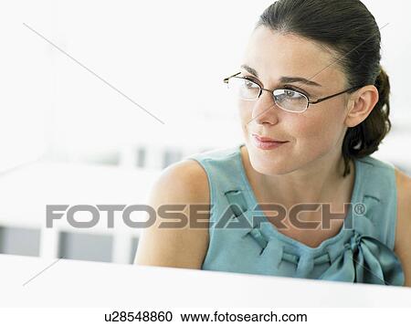 Stock Image - Business Woman in thought. Fotosearch