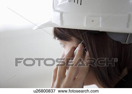 Stock Photo - Business woman on mobile phone. Fotosearch