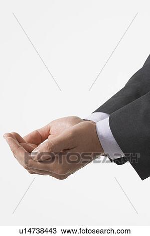 Businessman Cupping His Hands, close-up on hands View Large Photo Image Stock Image - Businessman Cupping His Hands, close-up on hands. Fotosearch