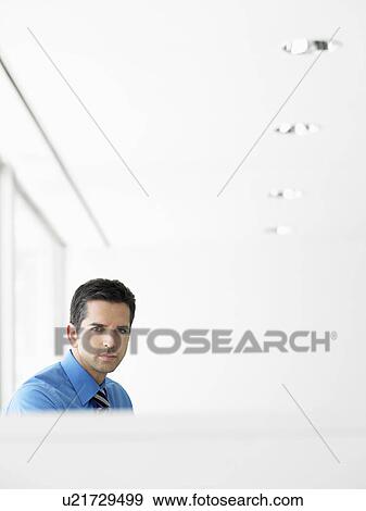 Stock Photo - Businessman in office, portrait. Fotosearch