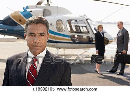 Stock Photography - Businesspeople by helicopter. Fotosearch