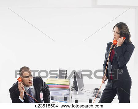 Businesspeople on the phone View Large Photo Image Picture - Businesspeople on the phone. Fotosearch