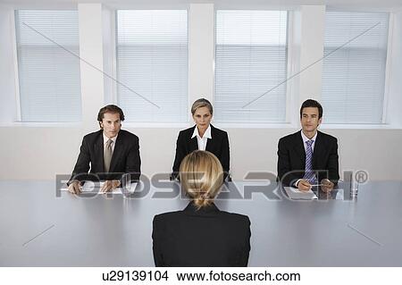Businesswoman Giving Presentation to Executive Team View Large Photo Image Picture - Businesswoman Giving Presentation to Executive Team. Fotosearch