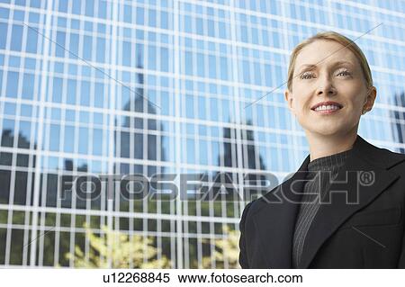 Businesswoman outside office building, portrait View Large Photo Image Stock Photography - Businesswoman outside office building, portrait. Fotosearch