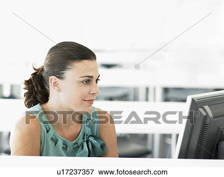 Stock Photo - Businesswoman Using Computer. Fotosearch