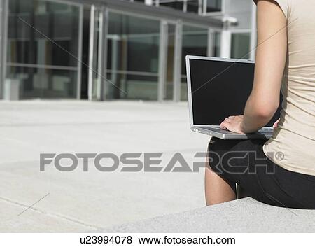 Businesswoman Using Laptop Outdoors View Large Photo Image Stock Photo - Businesswoman Using Laptop Outdoors. Fotosearch