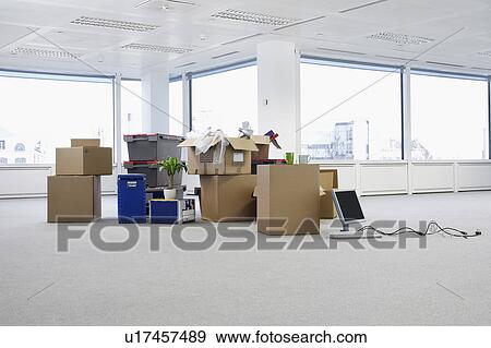 Cartons and equipment on floor of empty office space View Large Photo Image Stock Photo - Cartons and equipment on floor of empty office space. Fotosearch