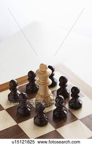 Stock Photography - Chess game, white king surrounded by black pawns. Fotosearch