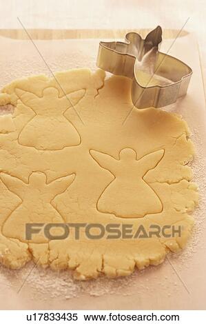 Christmas cookie dough with shape cutter View Large Photo Image Stock Photography - Christmas cookie dough with shape cutter. Fotosearch
