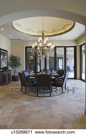 Stock Image - Circular dining room with ceiling detail. Fotosearch