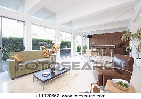 Contrasting coloured leather furniture in open plan living area View Large Photo Image Stock Image - Contrasting coloured leather furniture in open plan living area. Fotosearch