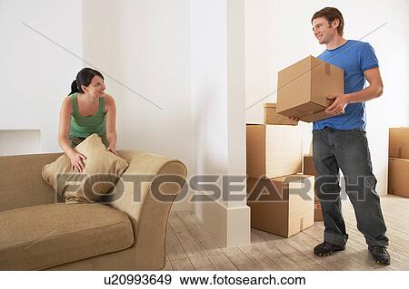 Stock Photo - Couple Moving into New Home. Fotosearch