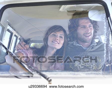 Couple Sitting in camper van, view through windscreen View Large Photo Image Picture - Couple Sitting in camper van, view through windscreen. Fotosearch