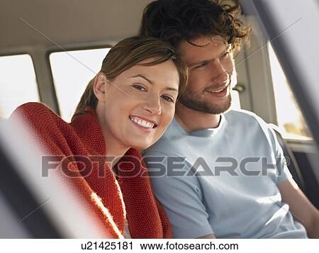Couple sitting in front seat of van, close up View Large Photo Image Stock Image - Couple sitting in front seat of van, close up. Fotosearch