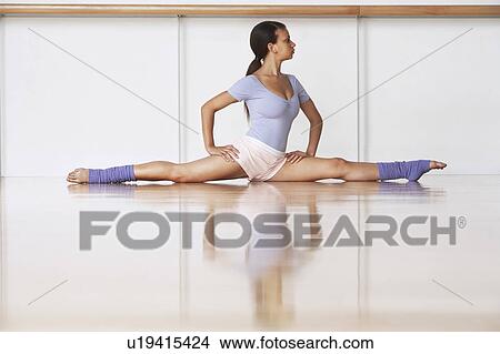 Picture - Dancer Stretching on floor. Fotosearch