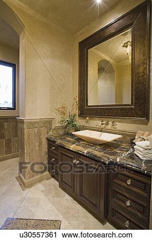 Dark brown bathroom unit with leather mirror frame View Large Photo Image Stock Image - Dark brown bathroom unit with leather mirror frame. Fotosearch