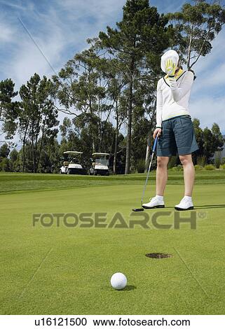 Disappointed golfer on putting green View Large Photo Image Stock Image - Disappointed golfer on putting green. Fotosearch