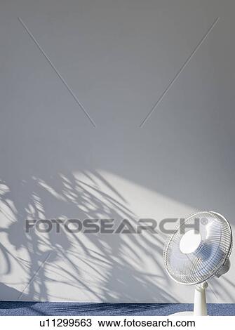 Stock Image - Electric fan in empty room. Fotosearch