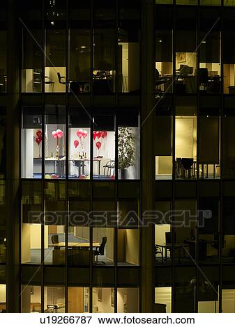 Empty office after party, view from building exterior View Large Photo Image Stock Photo - Empty office after party, view from building exterior. Fotosearch
