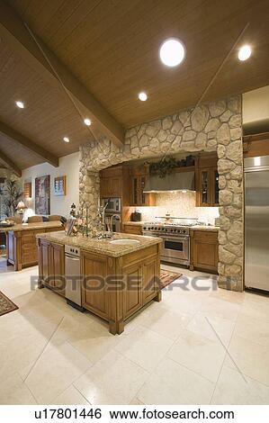 Exposed stone kitchen surround with spotlights on wooden ceiling View Large Photo Image Stock Photograph - Exposed stone kitchen surround with spotlights on wooden ceiling. Fotosearch