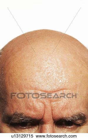 Stock Photography - Eyes and head of middle-aged man. Fotosearch