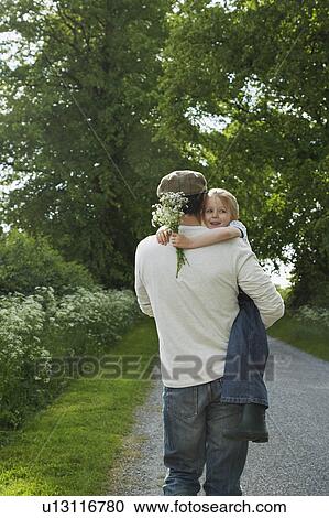Father and daughter (5-6) embracing on country lane View Large Photo Image Stock Image - Father and daughter (5-6) embracing on country lane. Fotosearch