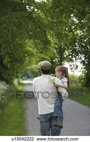 Father and daughter (5-6) embracing on country lane View Large Photo Image Stock Image - Father and daughter (5-6) embracing on country lane. Fotosearch