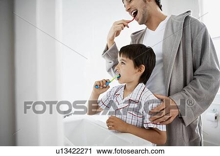 Father and Son Brushing Teeth in bathroom View Large Photo Image Stock Image - Father and Son Brushing Teeth in bathroom. Fotosearch