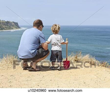 Father and son on coastal cliff, CA View Large Photo Image Stock Image - Father and son on coastal cliff, CA. Fotosearch
