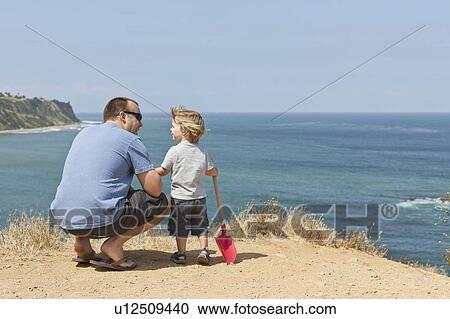 Father and son on coastal cliff, CA View Large Photo Image Stock Image - Father and son on coastal cliff, CA. Fotosearch