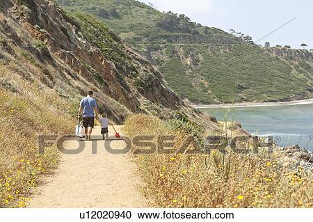 Father and son walking on coastal path, CA View Large Photo Image Stock Image - Father and son walking on coastal path, CA. Fotosearch