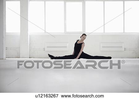 Female dancer doing the splits View Large Photo Image Stock Photo - Female dancer doing the splits. Fotosearch