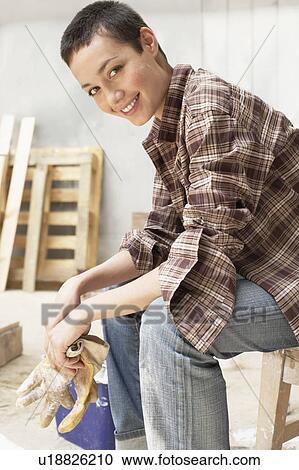 Female painter on Work Break in tool room, portrait, side view View Large Photo Image Stock Image - Female painter on Work Break in tool room, portrait, side view. Fotosearch