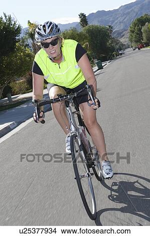 Picture - Female road cyclist. Fotosearch