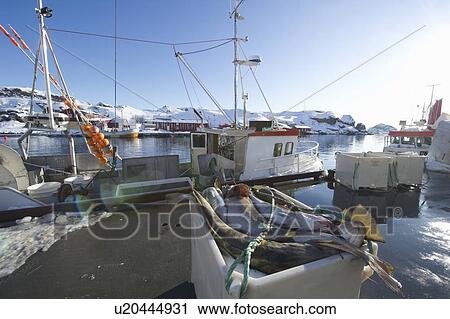 Stock Image - Fishing boat in harbour, Norway. Fotosearch