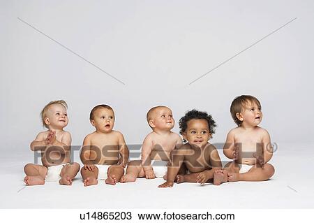 Five babies, one looking in different direction View Large Photo Image Stock Image - Five babies, one looking in different direction. Fotosearch
