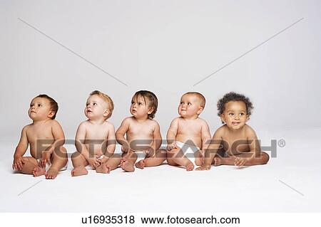 Five babies, one looking in different direction View Large Photo Image Stock Photo - Five babies, one looking in different direction. Fotosearch