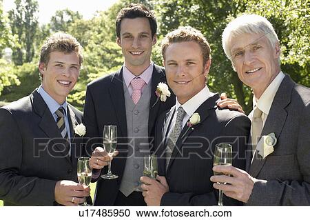 Four men toasting at wedding, portrait View Large Photo Image Stock Image - Four men toasting at wedding, portrait. Fotosearch
