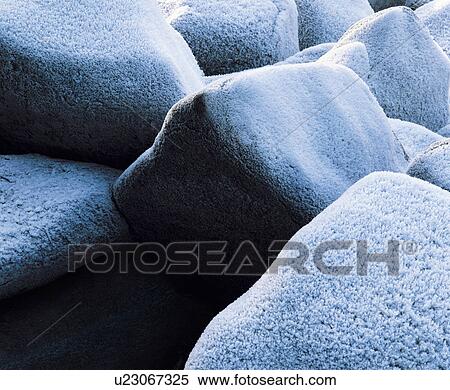 Stock Photography - Frost on rocks, close-up. Fotosearch