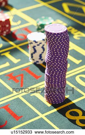 Stock Image - Gambling Chips on Roulette Table, close up. Fotosearch