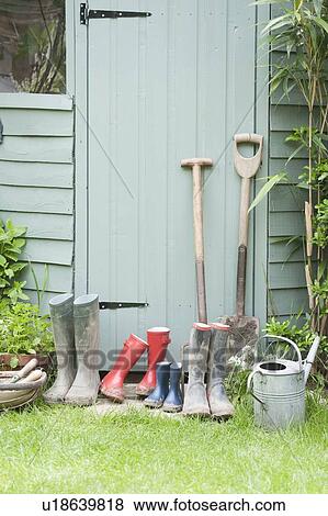 Gardening tools at door of potting shed View Large Photo Image Stock Photo - Gardening tools at door of potting shed. Fotosearch