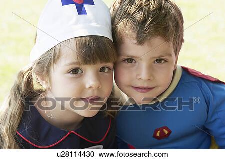 Girl and boy dressed up as Nurse and Superhero in park, portrait View Large Photo Image Stock Image - Girl and boy dressed up as Nurse and Superhero in park, portrait. Fotosearch