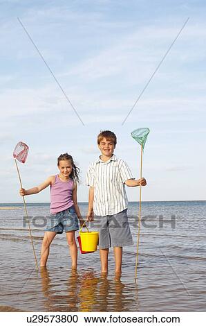 Girl and Boy Playing at Beach View Large Photo Image Stock Image - Girl and Boy Playing at Beach. Fotosearch