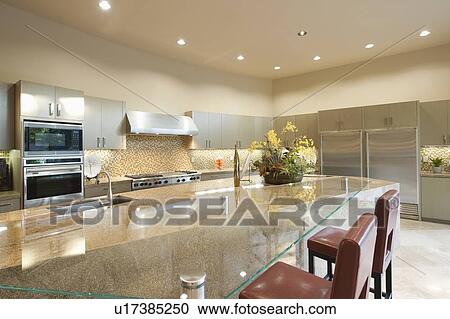 Glass topped kitchen surface with stainless steel fitted units View Large Photo Image Stock Image - Glass topped kitchen surface with stainless steel fitted units. Fotosearch