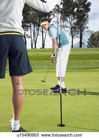 Golfer putting View Large Photo Image Stock Image - Golfer putting. Fotosearch