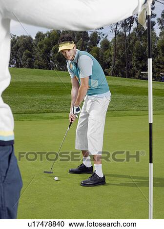 Golfer putting View Large Photo Image Stock Image - Golfer putting. Fotosearch