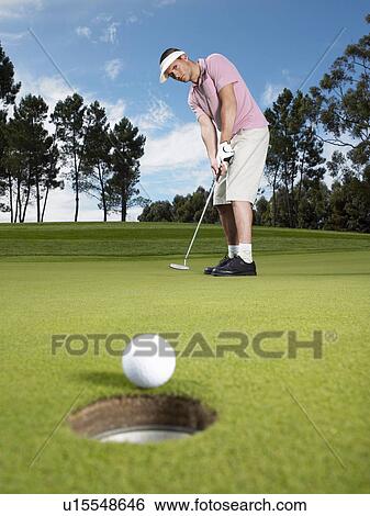 Stock Photograph - Golfer Putting. Fotosearch