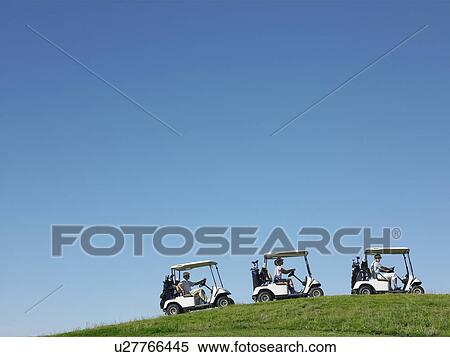 Stock Photography - Golfers driving carts. Fotosearch